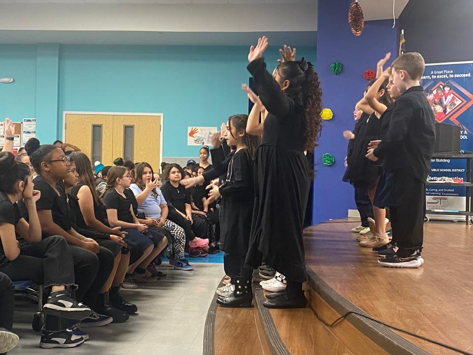 First grade students perform "We are the World" at the School of Science and Technology Corpus Christi's Black History Month event Thursday.