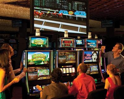 Shown are slot machines at Hialeah Park Casino in Florida in this May 9, 2013, AP photo. Virtual Racing puts players in the driver's seat and creates a thrilling community event. This entertaining and interactive secondary bonus game is already proven to increase coin-in and carded play. Hialeah Park Casino selected Bally’s Innovative Games and Systems Solutions.