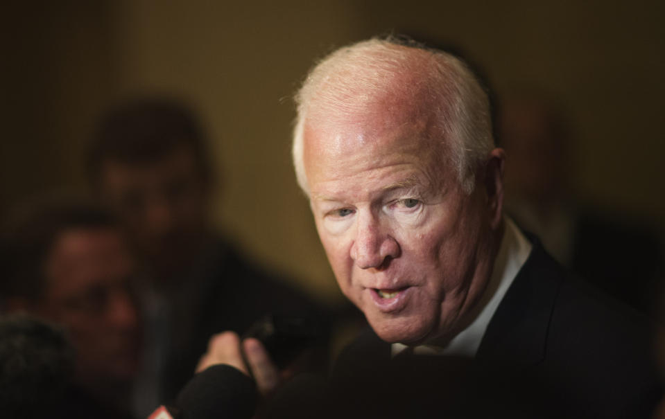 FILE - Outgoing U.S. Sen. Saxby Chambliss, R-Ga., talks to reporters at an election night party for Georgia Republican U.S. Senate candidate David Perdue, Nov. 4, 2014, in Atlanta. The Republican Chambliss said on Tuesday, June 25, 2024, that he's banding together with three other prominent former Georgia officials to push back against efforts to undermine elections. (AP Photo/David Goldman, File)