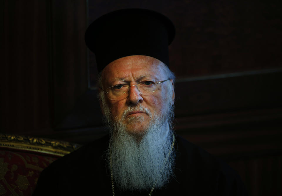 FILE - In this Monday, May 11, 2015 file photo, Ecumenical Patriarch Bartholomew I, the spiritual leader of the world's Orthodox Christians, listens during a meeting at the Patriarchate in Istanbul. On July 2, 2020, Turkey's Council of State, the country's highest administrative court, is scheduled to begin reviewing a request made by a group devoted to reverting the Byzantine-era and UNESCO World Heritage Hagia Sophia into a mosque. Bartholomew I noted that Hagia Sophia had served as a place of worship for Christians for 900 years and for Muslims for 500 years, and added: "the potential conversion of Hagia Sophia into a mosque will turn millions of Christians across the world against Islam." (AP Photo/Lefteris Pitarakis, File)