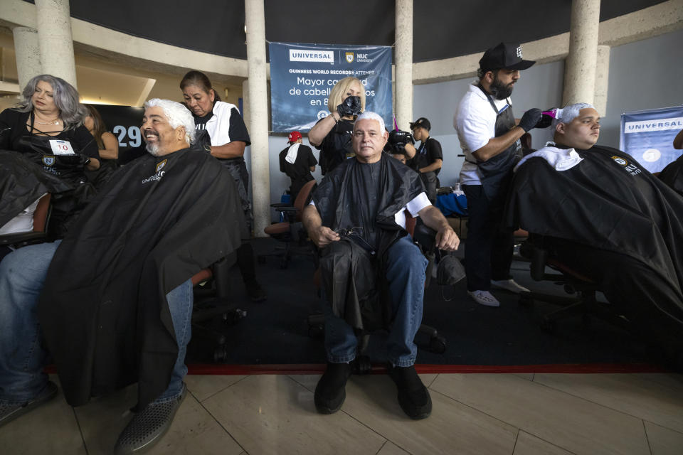 Puerto Rico tries to break the Guinness record for the most hair dyed in 8 hours. This in support of the Puerto Rican baseball team that participates in the 2023 world baseball classic. in Guaynabo, Puerto Rico, Friday, March 10, 2023.(AP Photo/Alejandro Granadillo)