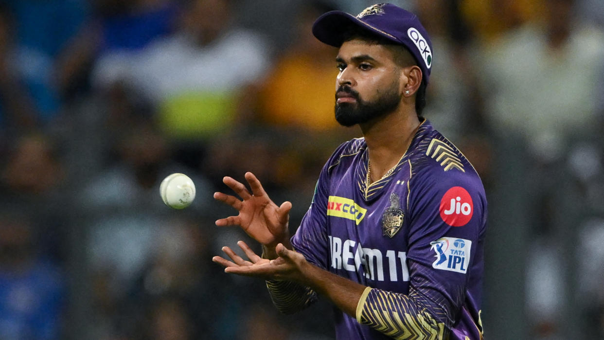  Kolkata Knight Riders' captain Shreyas Iyer collects a throw during the Indian Premier League (IPL) Twenty20 cricket match between Mumbai Indians and Kolkata Knight Riders . 