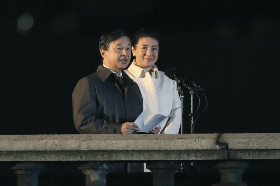 Emperor Naruhito delivers a speech as Empress Masako listens during a ceremony to mark his enthronement in Tokyo Saturday, Nov. 9, 2019. Naruhito thanked tens of thousands of well-wishers who gathered outside the palace to congratulate his enthronement at the ceremony organized by conservative political and business groups. (AP Photo/Koji Sasahara, Pool)