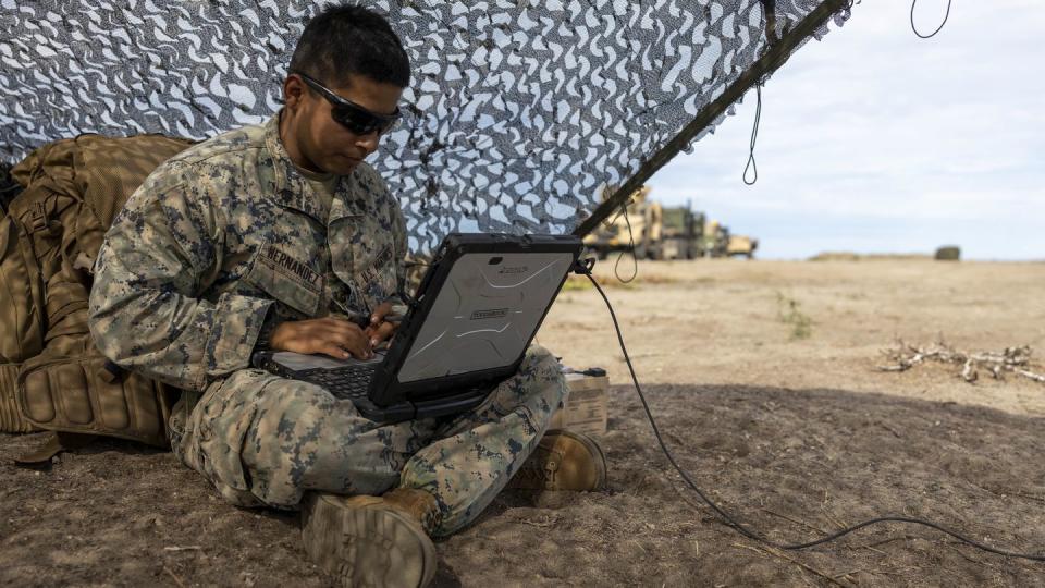 U.S. Marine Corps Sgt. Francisco Hernandez, a surveillance sensor operator with the 13th Marine Expeditionary Unit, creates a flight mission plan for an RQ-20B Puma at a sensing expeditionary advanced base on Sept. 4, 2022, on San Clemente Island, Calif. (Cpl. Austin Gillam/U.S. Marine Corps)