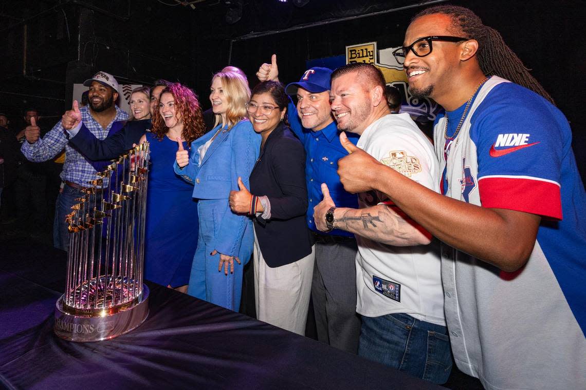 Fort Worth Mayor Mattie Parker, center, and other members of city council take a photo with the World Series Commissioners Trophy during a Texas Rangers World Series celebration event at Billy Bob’s Texas in Fort Worth on Thursday, Nov. 9, 2023. Chris Torres/ctorres@star-telegram.com
