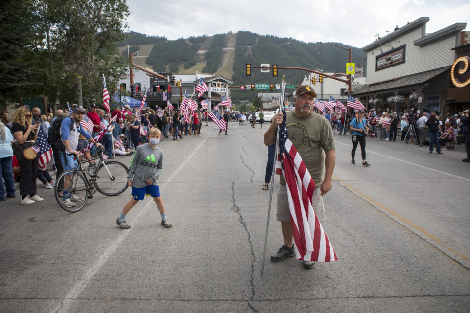 Rob Anderson, of Alpine, Wyo., watches for the procession of Marine Lance Cpl. Rylee McCollum in Jackson, Wyo., Friday, Sept. 10, 2021. McCollum was one of the service members killed in Afghanistan after a suicide bomber attacked Hamid Karzai International Airport on Aug. 26. (AP Photo/Amber Baesler)