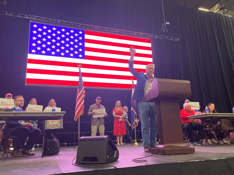 Russ Andrews raises his hand at the CO-3 assembly in Pueblo on April 5, 2024.