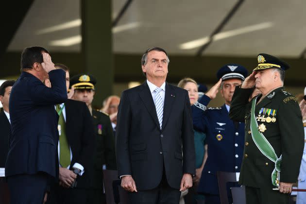 Brazilian President Jair Bolsonaro, who named a retired general as his vice presidential running mate, has sought to enlist the military's backing for his efforts to undermine Brazil's elections, sparking fears of a potential coup. (Photo: Evaristo Sa via Getty Images)