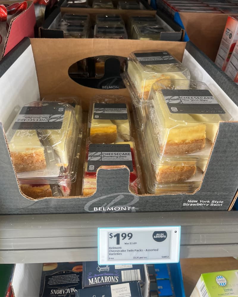 2 slices of cheesecake packaged on shelf with price tag