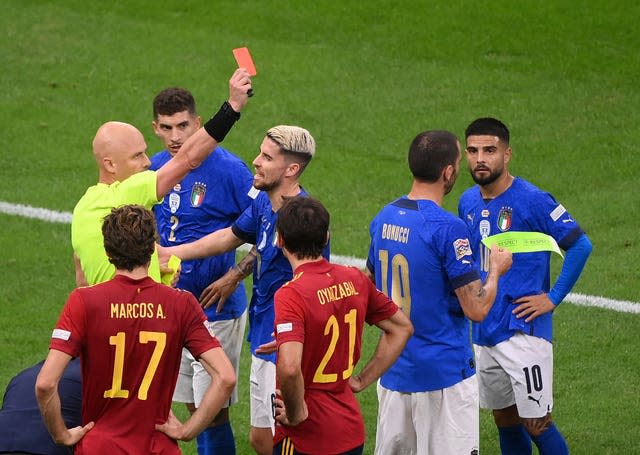 Italy defender Leonardo Bonucci, second right, was sent off in Milan