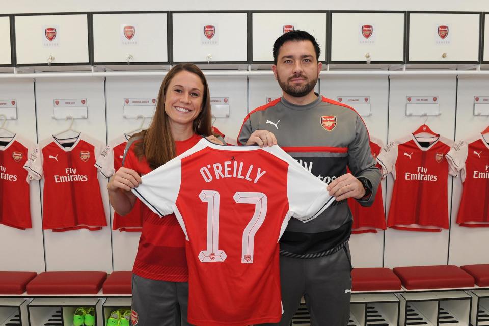 New signing: O'Reilly poses with Martinez Losa: Arsenal FC via Getty Images