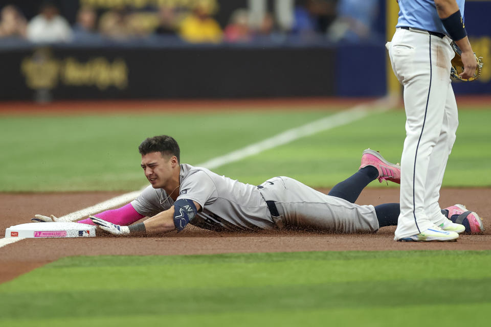 New York Yankees' Anthony Volpe slides in with a triple against the Tampa Bay Rays during the first inning of a baseball game Sunday, May 12, 2024, in St. Petersburg, Fla. (AP Photo/Mike Carlson)
