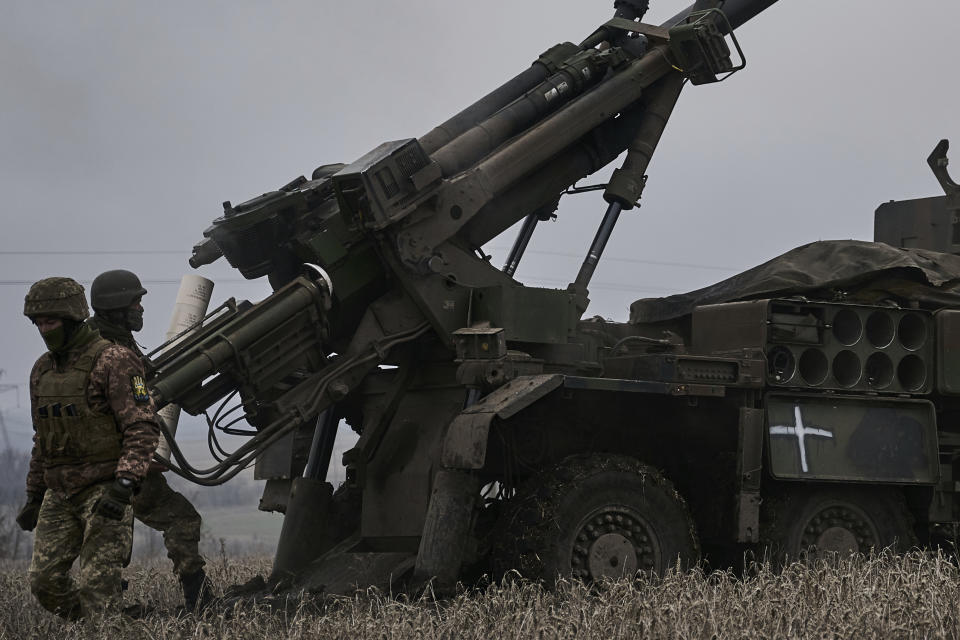 Ukrainian soldiers prepare to fire a French-made CAESAR self-propelled howitzer towards Russian positions near Avdiivka, Donetsk region, Ukraine, Monday, Dec. 26, 2022. (AP Photo/Libkos)