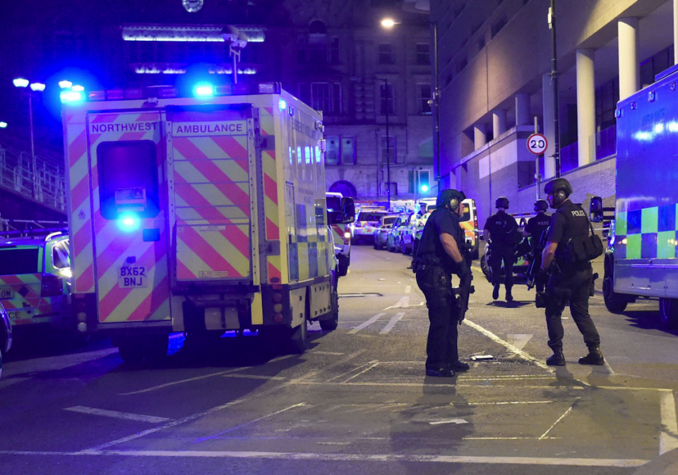 Police on guard at Manchester Arena after the May 22 attack (REX)