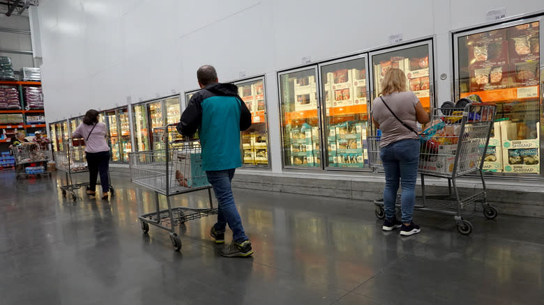 People shopping for frozen food