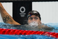 Caeleb Dressel, of United States, finishes a men's 50-meter freestyle semifinal at the 2020 Summer Olympics, Saturday, July 31, 2021, in Tokyo, Japan. (AP Photo/Jae C. Hong)