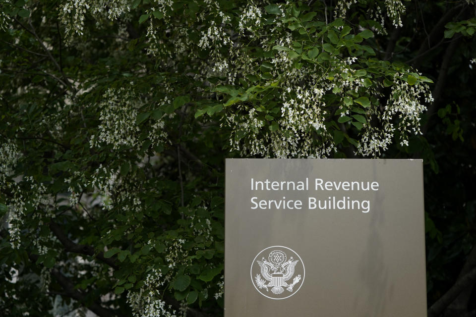 FILE - A sign for the Internal Revenue Service building in Washington, May 4, 2021. The IRS plans to end another major tax loophole that could raise more than $50 billion in revenue over the next decade, the U.S Treasury says.(AP Photo/Patrick Semansky, File)