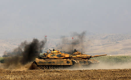 Turkish tanks maneuver during a military exercise near the Turkish-Iraqi border in Silopi, Turkey, September 22, 2017. REUTERS/Umit Bektas