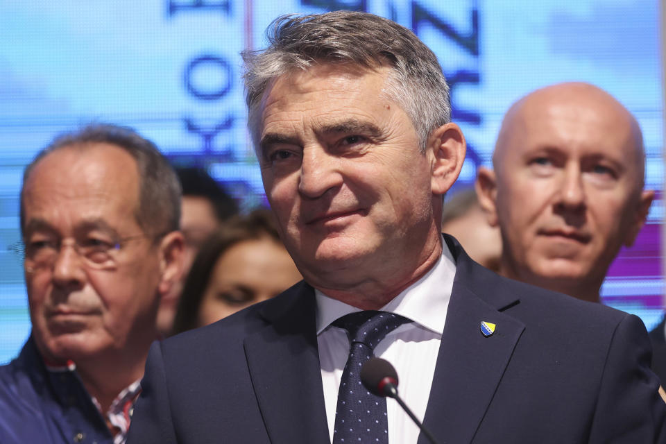 Zeljko Komsic of Democratic Front Party (DF) smiles at a news conference where he declared himself the winner of the Croat seat of the tripartite Bosnian Presidency in Sarajevo, Bosnia, Sunday, Oct. 2, 2022. (AP Photo/Armin Durgut)