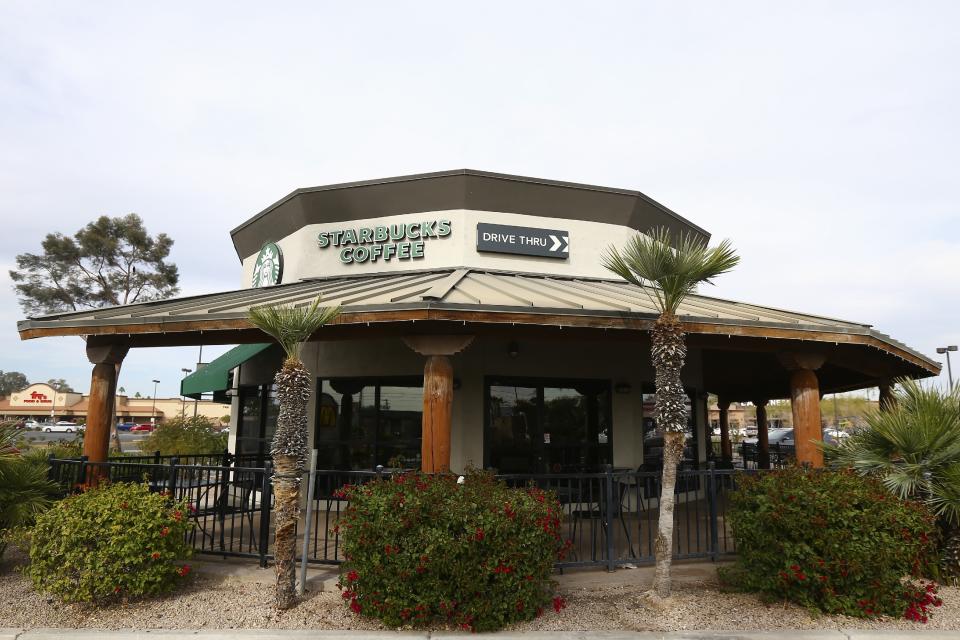 This Wednesday, Jan. 15, 2020, photo, shows a Starbucks Community Store, which offers customers the usual Starbucks products along with a large space for community meetings and programs, in Phoenix. The Seattle-based company plans to open or remodel 85 stores by 2025 in rural and urban communities across the U.S. That will bring to 100 the total number of community stores Starbucks has opened since it announced the program in 2015. (AP Photo/Ross D. Franklin)