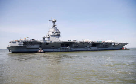 FILE PHOTO: Pre-Commissioning Unit Gerald R. Ford (CVN 78) is maneuvered by tug boats in the James River during the aircraft carrier's turn ship evolution in Newport News, Virginia, U.S. June 11, 2016. U.S. Navy/Mass Communication Specialist Seaman Apprentice Gitte Schirrmacher/Handout via REUTERS/File Photo