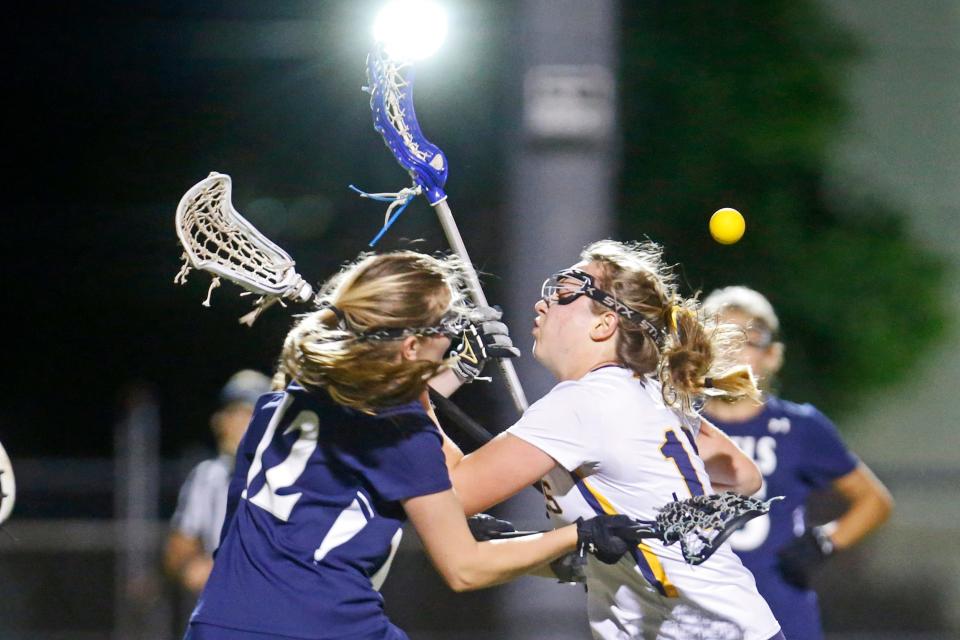 Barrington's Reilly Curran, right, loses possession after running into South Kingstown's Page Hedde during the second half on Wednesday.