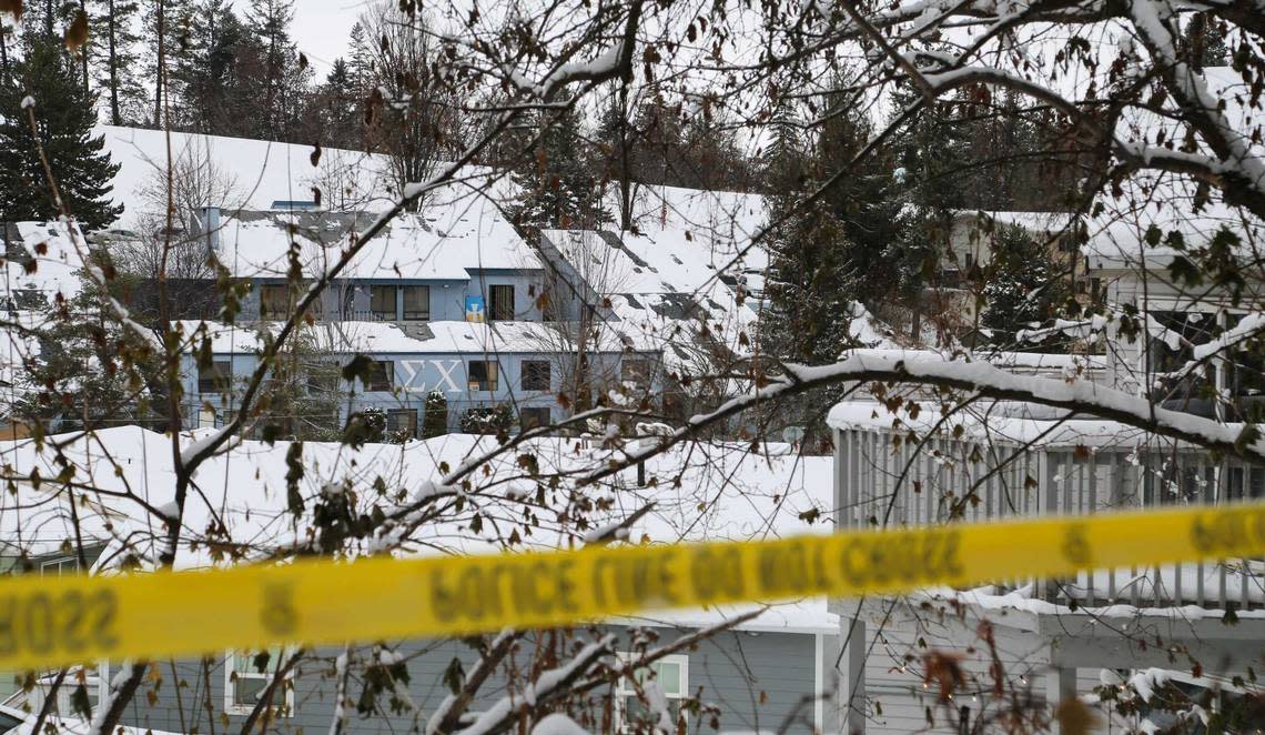 The Sigma Chi fraternity house, left, on Nez Perce Drive can be seen from outside the perimeter of the King Road house where four University of Idaho students were stabbed to death Nov. 13. Two of the victims, Ethan Chapin and his girlfriend, Xana Kernodle, attended a party at Sigma Chi for about five hours before returning to the off-campus home on King Road, the balcony of which can be seen on the right.