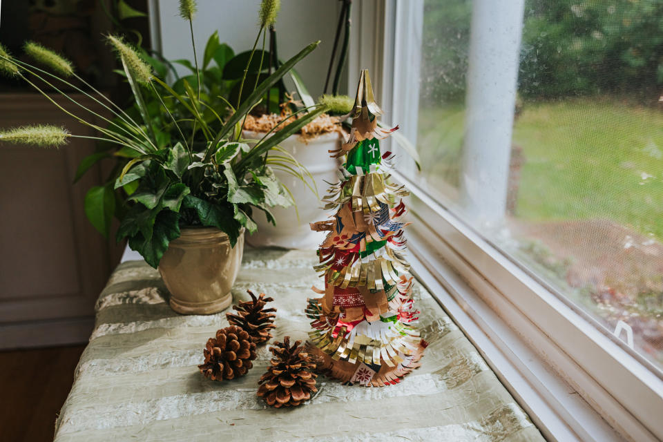 A Christmas tree made from leftover wrapping paper scraps. 