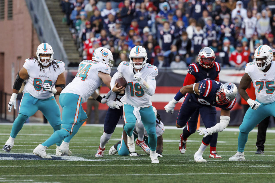 Miami Dolphins quarterback Skylar Thompson (19) scrambles for yardage during fourth quarter of an NFL football game, in Foxborough, Mass., Sunday, Jan. 1, 2023. (David Santiago/Miami Herald via AP)