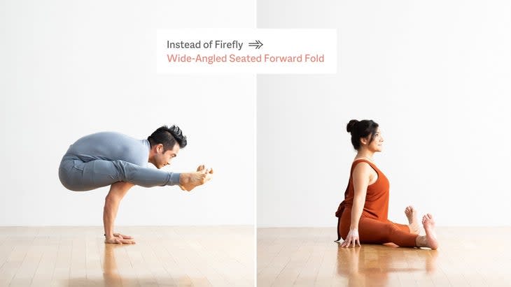 A man in light blue clothes practices Firefly Pose; a woman in rust colored clothes sits in wide-angled forward fold