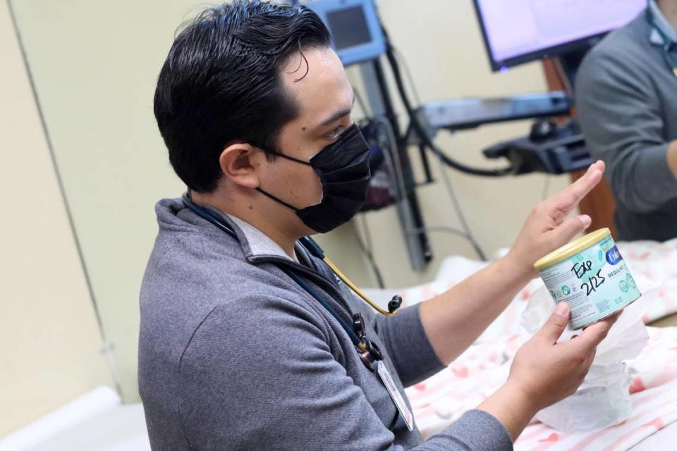 Pediatric doctor Rodrigo De La Cruz explains to the mother of one of his patients what to do at home during a checkup on the baby at the Altura Centers for Health clinic in West Tulare on September 7, 2023.