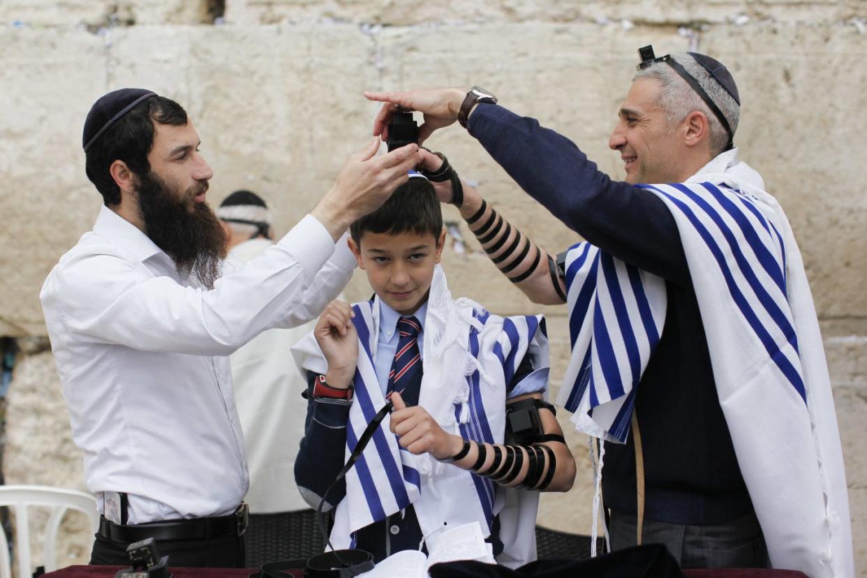 <span class="caption">The Jewish ritual of bar mitzvah. which marks a 13-year-old young man’s assumption of religious and legal obligations under Jewish law.</span> <span class="attribution"><a class="link " href="https://www.flickr.com/photos/israelphotogallery/16977015801" rel="nofollow noopener" target="_blank" data-ylk="slk:Israel_photo_gallery;elm:context_link;itc:0;sec:content-canvas">Israel_photo_gallery</a>, <a class="link " href="http://creativecommons.org/licenses/by-nd/4.0/" rel="nofollow noopener" target="_blank" data-ylk="slk:CC BY-ND;elm:context_link;itc:0;sec:content-canvas">CC BY-ND</a></span>