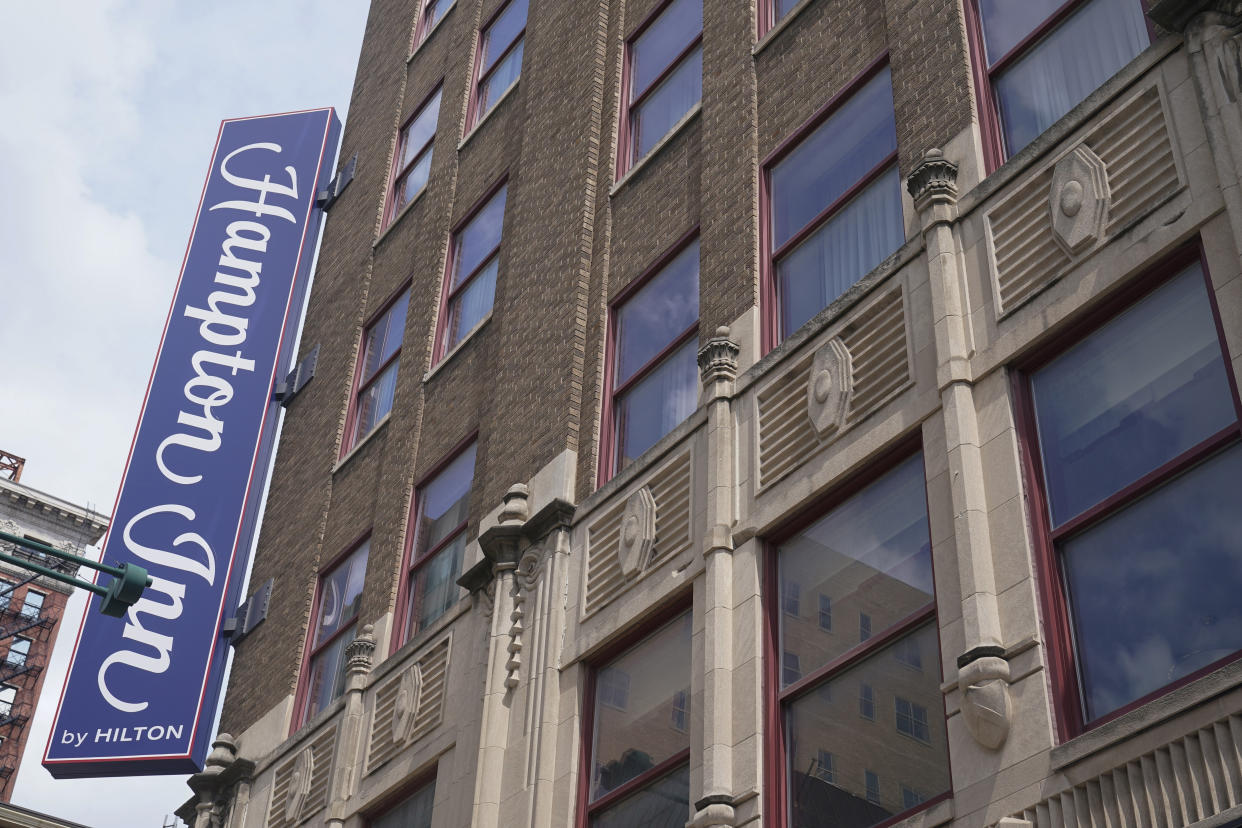 The Hampton Inn photographed, Monday, Aug. 29, 2022, in Indianapolis. Three members of the Dutch Commando Corps, who were training at a center, were shot outside of the hotel in downtown Indianapolis early Saturday morning. The Dutch Defense Ministry says that one has died. (AP Photo/Darron Cummings)