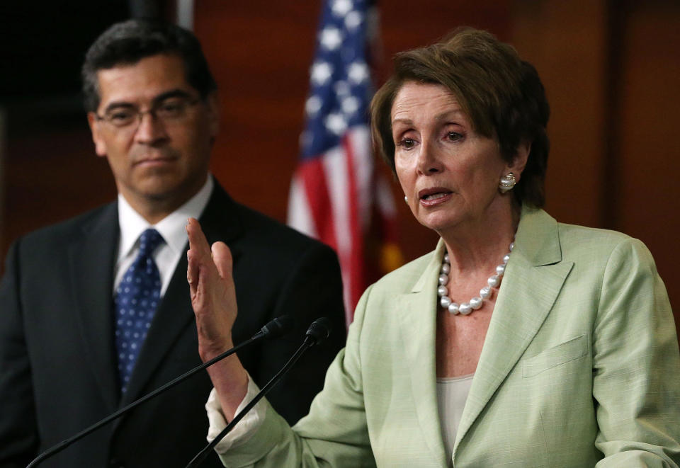 House Minority Leader Nancy Pelosi (D-CA) (R) speaks to the media with Rep. Xavier Becerra (D-CA) after a meeting with President Barack Obama on Capitol Hill, July 31, 2013 in Washington, D.C.  (Photo by Mark Wilson/Getty Images)