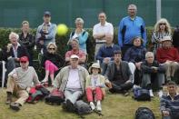 Spectators watch the singles match between Britain's Katy Dunne and Ukraine's Anhelina Kalinina during the Wimbledon Tennis Championships qualifying rounds at the Bank of England Sports Centre in Roehampton, southwest London, Britain June 23, 2015. REUTERS/Suzanne Plunkett