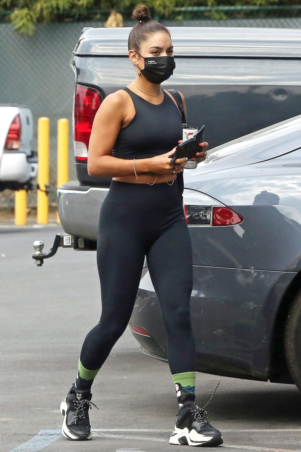 <p>Vanessa Hudgens wears a mask on her way to the gym on Monday in L.A. </p>
