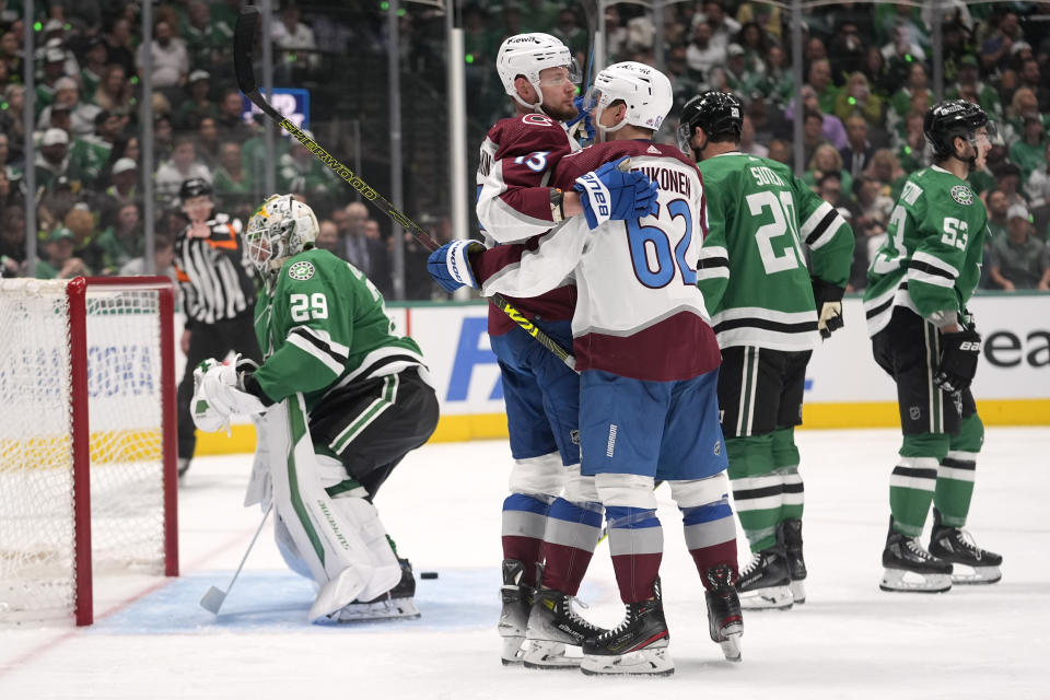 Colorado Avalanche's Valeri Nichushkin, center left, and Artturi Lehkonen (62) celebrate a goal scored by Nichushkin as Dallas Stars' Jake Oettinger (29), Ryan Suter (20) and Wyatt Johnston, recover from the play in the second period in Game 2 of an NHL hockey Stanley Cup second-round playoff series in Dallas, Tuesday, May 7, 2024. (AP Photo/LM Otero)