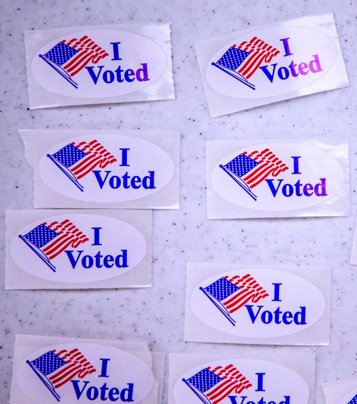 Voting stickers lie on a table during an earlier election this year at Northwest Baptist Church in Oklahoma City.