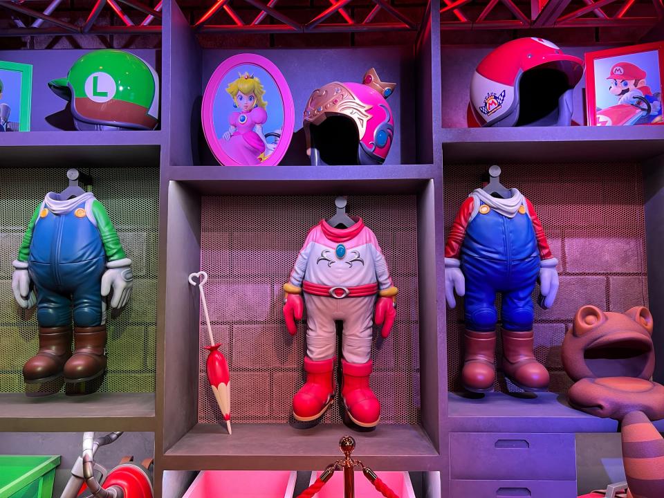 Just before they get on the Mario Kart ride, guests pass through the "locker room" with the suits of various characters hang.