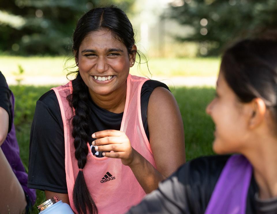 Anu Arumugarasa, of Sri Lanka, left, and Romisha Adhikari, of Nepal, laugh during a break at their #SheBelongs soccer practice at Lone Peak Park in Sandy on Thursday, July 6, 2023. #SheBelongs is a four-month program bringing together refugee and nonrefugee girls through soccer. | Megan Nielsen, Deseret News