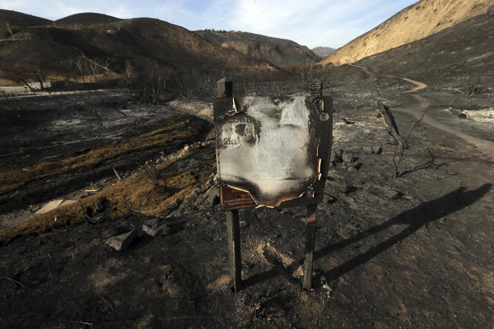 n this Tuesday, Nov. 13, 2018 photo, a sign designating the Corral Canyon Park recreation area stands amid landscape charred by the Woolsey fire in Malibu, Calif. Southern Californians faced with the loss of lives and homes in a huge wildfire are also grappling with the destruction of public lands popular with hikers, horseback riders and mountain bikers. The Woolsey fire has charred more than 83 percent of National Park Service land within the Santa Monica Mountain National Recreational Area. Officials announced Wednesday, Nov. 14, 2018, that all trails were closed. (AP Photo/Reed Saxon)