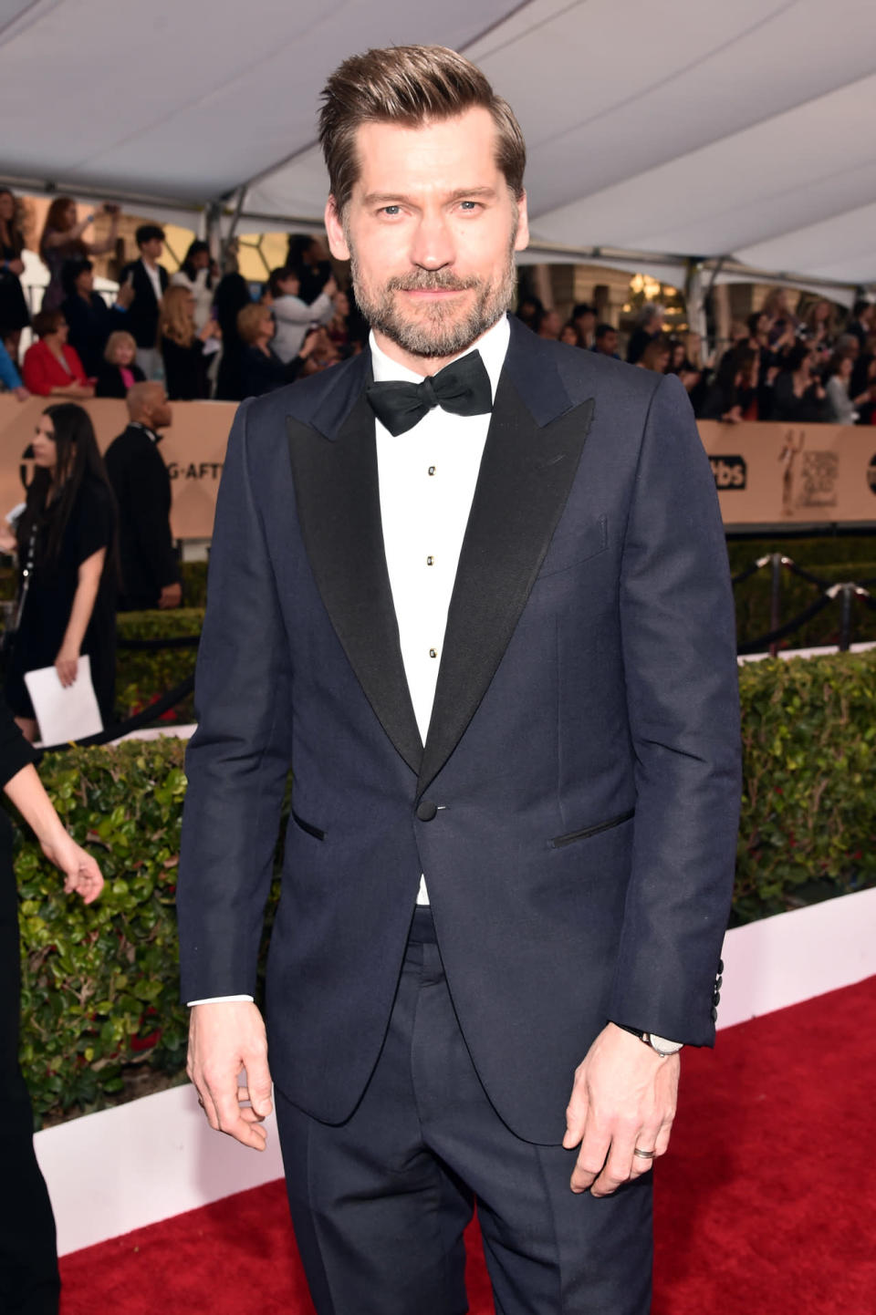 Nikolaj Coster-Waldau in a navy blue Dunhill London tuxedo with black lapels at the 22nd Annual Screen Actors Guild Awards at The Shrine Auditorium on January 30, 2016 in Los Angeles, California.