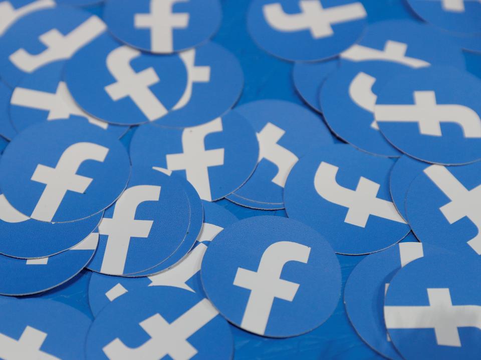 FILE PHOTO: Stickers bearing the Facebook logo are pictured at Facebook Inc's F8 developers conference in San Jose, California, U.S., April 30, 2019.  REUTERS/Stephen Lam