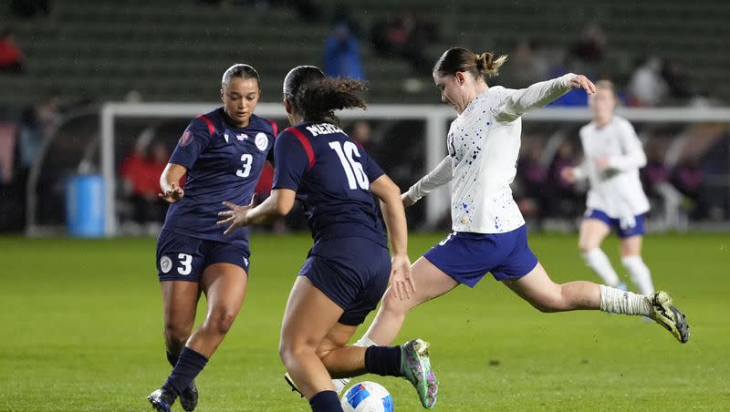 United States’ Olivia Moultrie (13) shoots the ball against Dominican Republic’s Stella Tapia (3) and Renata Mercerdes (16) during the CONCACAF Women’s Gold Cup tournament at Dignity Health Sports Park in Carson, Calif., Tuesday, Feb. 20, 2024.