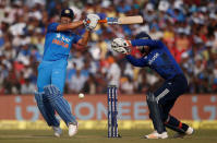 Cricket - India v England - Second One Day International - Barabati Stadium, Cuttack, India - 19/01/17. India's Mahendra Singh Dhoni (L) plays a shot. REUTERS/Adnan Abidi