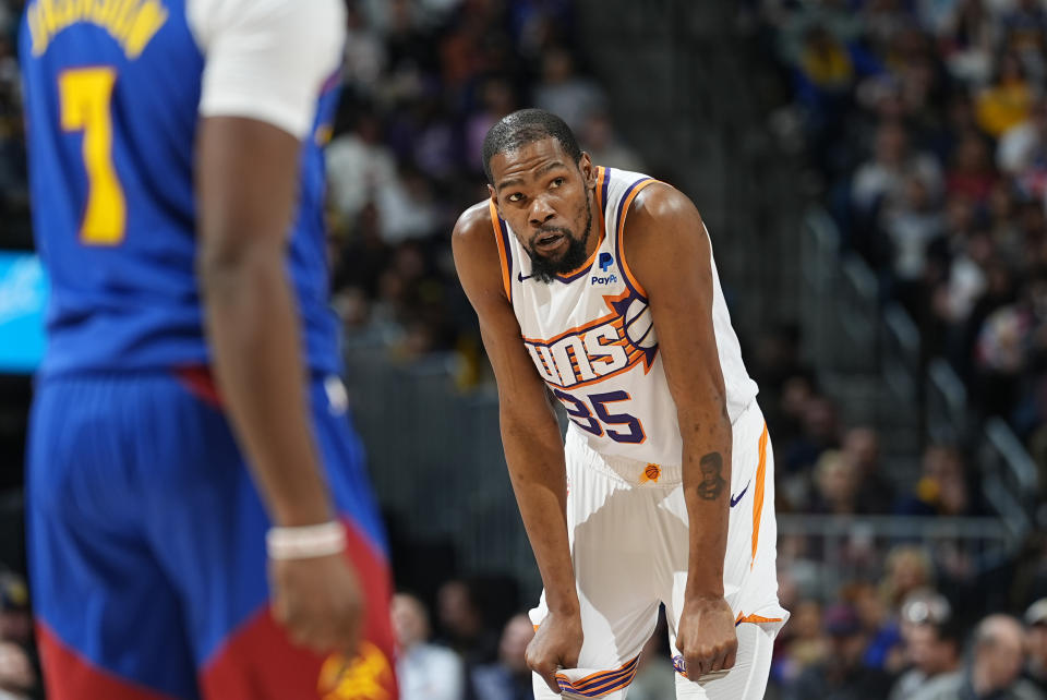 Phoenix Suns forward Kevin Durant waits for play to resume during the first half of the team's NBA basketball game against the Denver Nuggets on Tuesday, March 5, 2024, in Denver. (AP Photo/David Zalubowski)