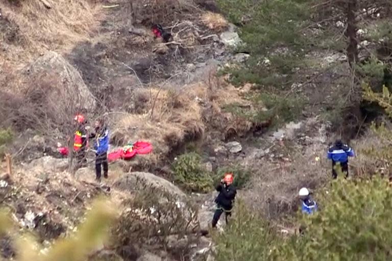 French search-and-rescue personnel make their way to the site where the Germanwings plane crashed in the French Alps above the southeastern town of Seyne