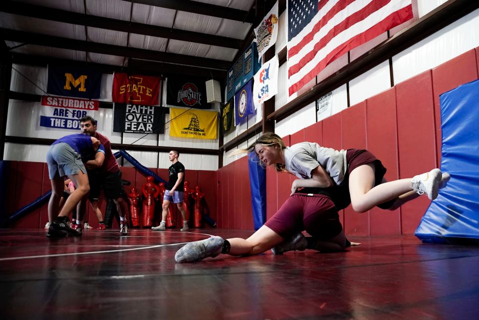 Hailee Moder, left, runs through a drill with a teammate during First Baptist Academy's practice at Coach Mike DiGrigolio's house in Naples on Tuesday, Feb. 14, 2023.