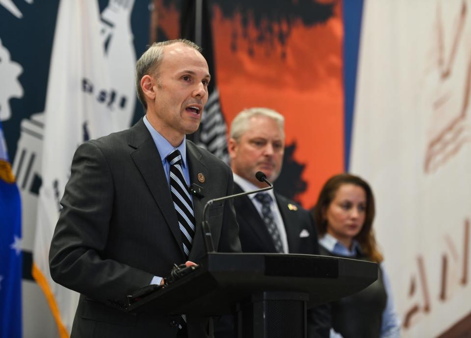 U.S. Attorney Mark Totten speaks Wednesday, Dec. 13, 2023, during a press conference at Lansing City Hall announcing charges in the death of a 2-year-old killed at Lansing gas station.