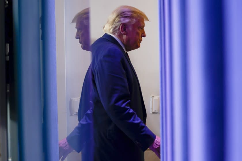 President Donald Trump leaves a news conference in the James Brady Press Briefing Room at the White House, Friday, Sept. 4, 2020, in Washington. (AP Photo/Evan Vucci)